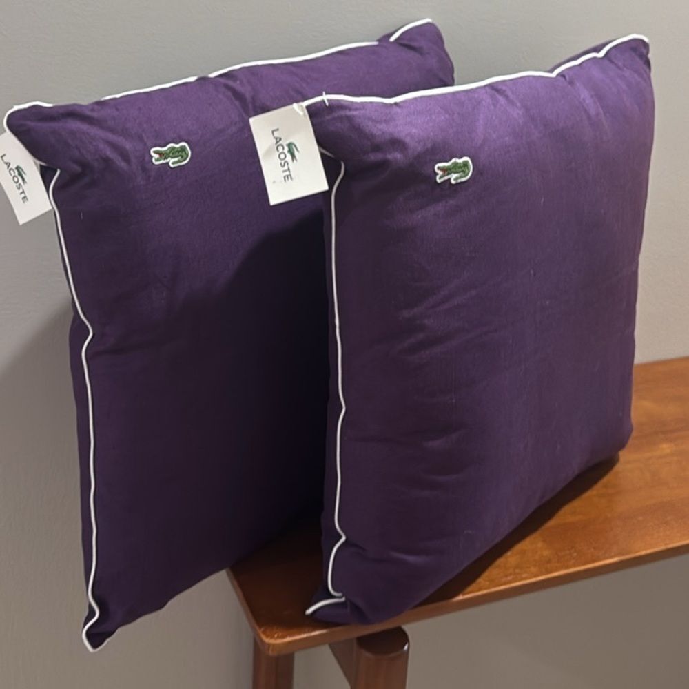 NWT. LACOSTE DECORATIVE PILLOWS. GOTHIC PURPLE GRAPE